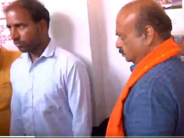 Karnataka CM and BJP candidate from Shiggaon assembly constituency, Basavaraj Bommai queues up at a polling booth here to cast his vote. (Photo: Twitter/ANI)