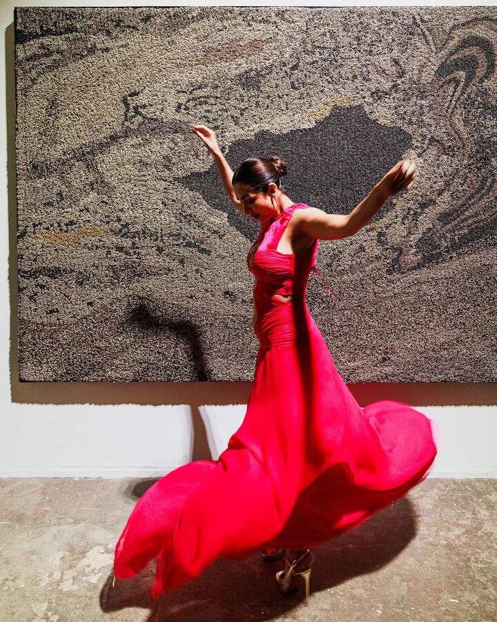 At the event, Malaika made heads turn in this red cut-out dress. (Image Source: Instagram/Malaika Arora)