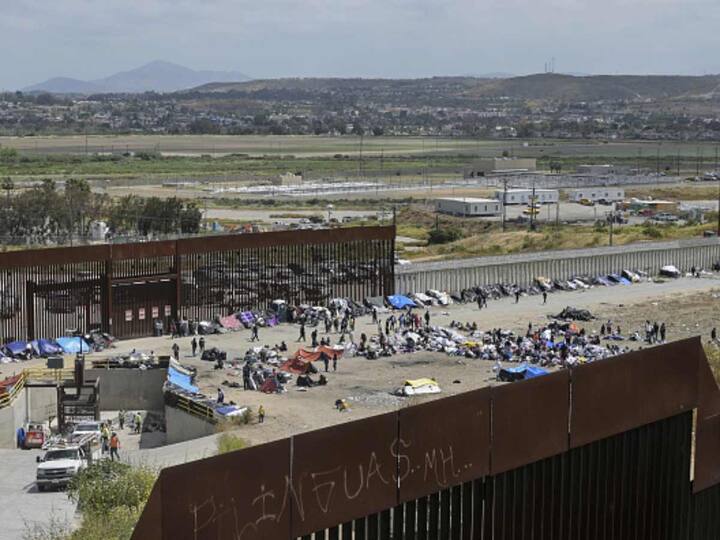 Thousands of migrants rushed across Mexico's border hours before pandemic-related asylum restrictions were to expire on Thursday (May 11), fearing that new policies would make it far more difficult to gain entry into the United States. Hundreds of migrants have camped out at the border between Tijuana, Mexico, and San Diego. (Source: Getty)