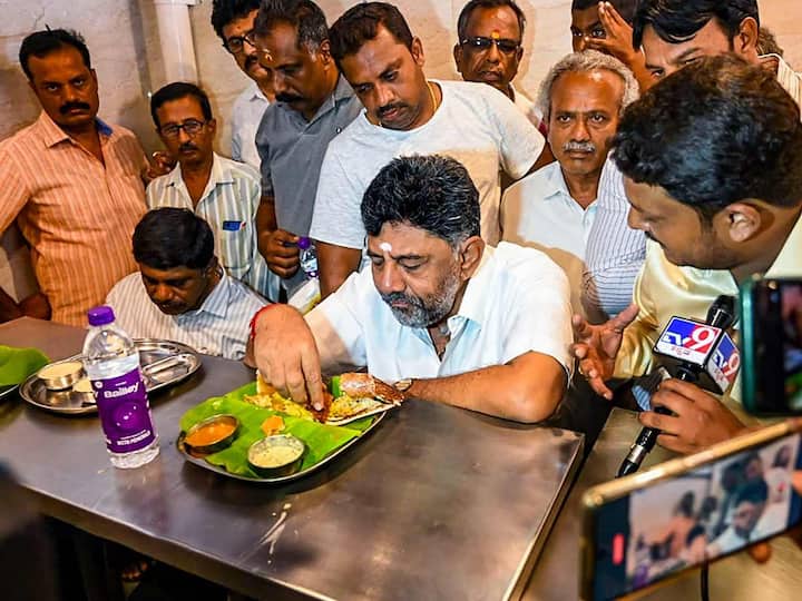 Meanwhile, Karnataka Congress President DK Shivakumar was seen eating breakfast in a hotel in Bengaluru on Thursday, as day after the elections ended in the state. Exit polls have predicted a hung Assembly, with Congress likely to emerge as the single largest party in the 224-member House. (Source: PTI)