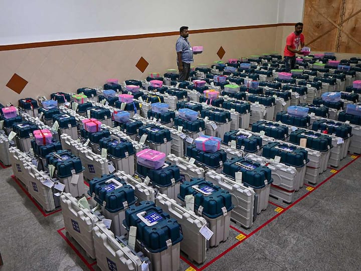 Workers are seen arranging EVMs in strong rooms after Karnataka went to elections on May 10. Karnataka registered a voter turnout of 73.19 per cent in the polls. (Source: PTI)