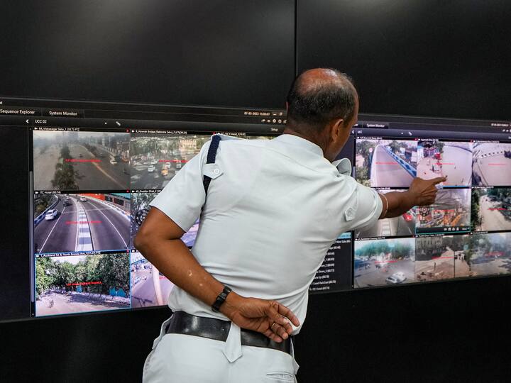 A Kolkata Police personnel monitors vulnerable locations and river banks through CCTV footage in preparation for the landfall of Cyclone 'Mocha', at an integrated control room at Police Headquarters Lalbazar, in Kolkata.