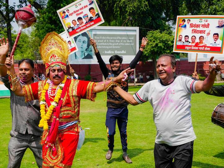 Some party workers were even seen dressed in colourful outfits and dancing while celebrating their victory in the Karnataka Assembly Elections. (Source: PTI)