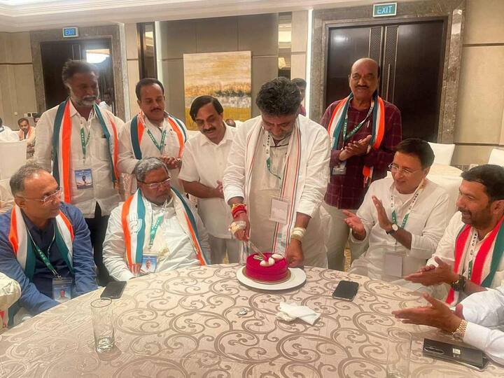 Karnataka Congress Chief DK Shivakumar celebrated his birthday by cutting a cake in a hotel in Bengaluru. Senior party leaders Randeep Surjewala, Siddaramaiah and others were present to celebrate his birthday after the Congress Legislature Party (CLP) meeting, in Bengaluru, early Monday on May 15. (Source: PTI)