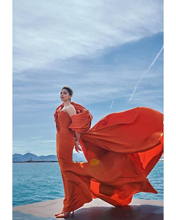 For her fourth outing, Deepika donned an orange sculpted gown and we couldn't help but drool over her gorgeous look.