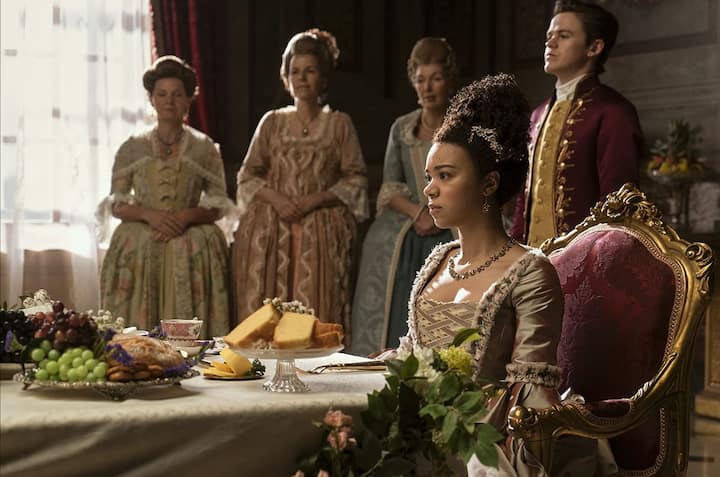 Queen Charlotte A Bridgerton Story is perhaps the best of all seasons due to its portrayal of real, difficult subjects like slave trade, Regency bill, racial discrimination, state of women, mannerisms, lineage etc. among other things
