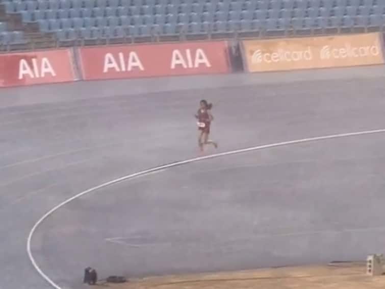 Watch Viral Video Cambodian runner Bou Samnang finishing 5000m race in rain goes viral 'Never Give Up': Cambodian Runner Continues Her 5,000-Metre Race In Pouring Rain, Video Goes Viral