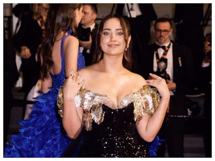 Content creator Kusha Kapila made her red carpet debut at Cannes wearing a golden and black Rahul Mishra gown.