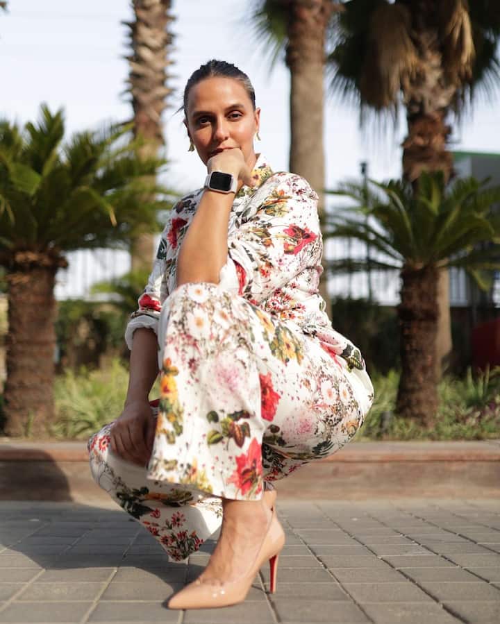She completed her look with nude makeup and tied her hair into a neat bun. (Image Source: Instagram/Neha Dhupia)