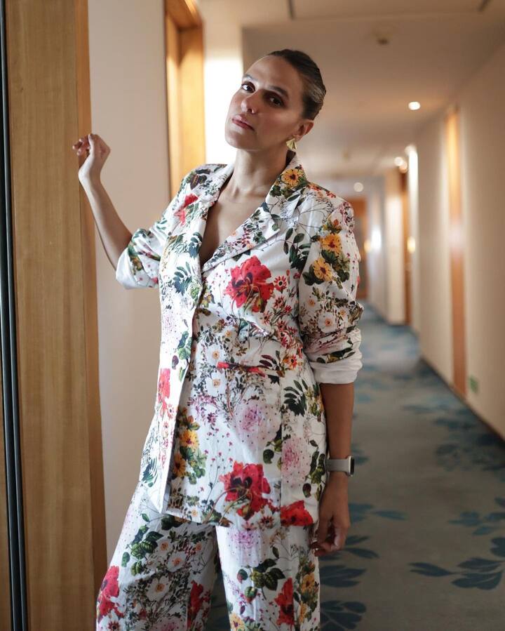 She accessorized her outfit with small earrings and a wrist watch. (Image Source: Instagram/Neha Dhupia)
