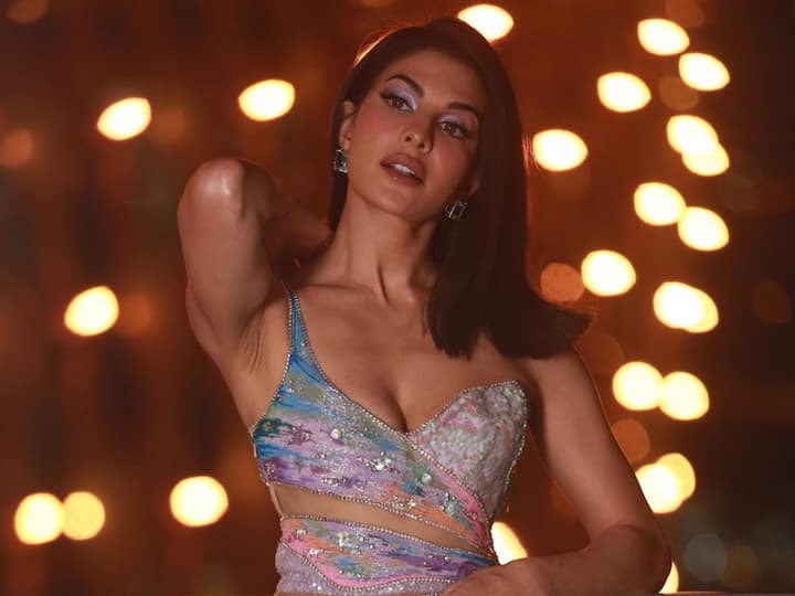 As the IIFA 2023 is underway, Jacqueline Fernandez treated her fans with pictures of herself in a multicoloured outfit looking dapper as ever. Check out pics.
