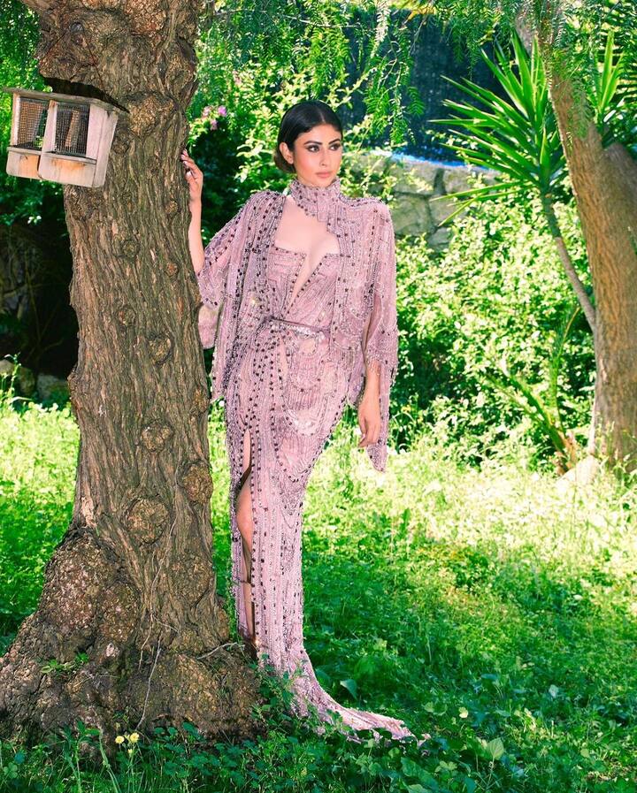 In the latest set of pictures shared by the actress, Mouni looks stunning as she poses by a tree in a lush green garden.