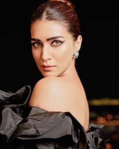 Kriti Sanon Aces Her Look In A Black Outfit Adorned With White Flowers