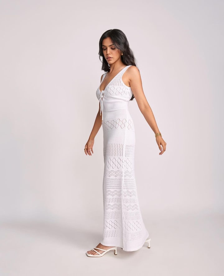 She wore a beautiful and lightweight white maxi dress by FRISKY.