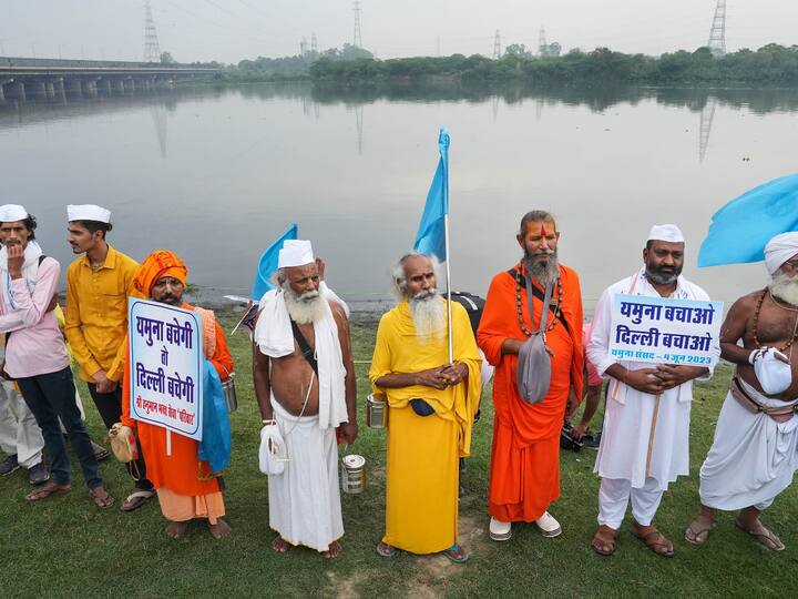 Sadhus and activists form a human chain along Yamuna river banks under the Yamuna Sansad initiative to save the river from heavy pollution.