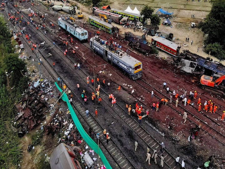 Ashwini Vaishnaw posted a video of a train moving freely on Balasore's railway lines in the presence of officials and hundreds of men at work. Along with officials, he was seen bowing his head in prayer as the train ran along restored tracks. (Image Source: PTI)