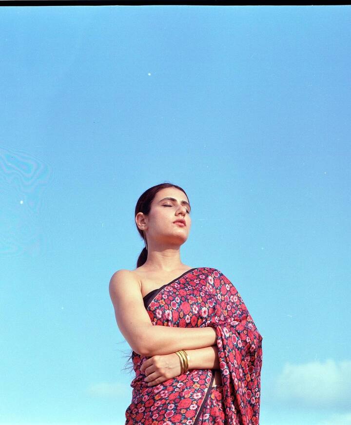 She wore a vibrant black floral cotton saree.