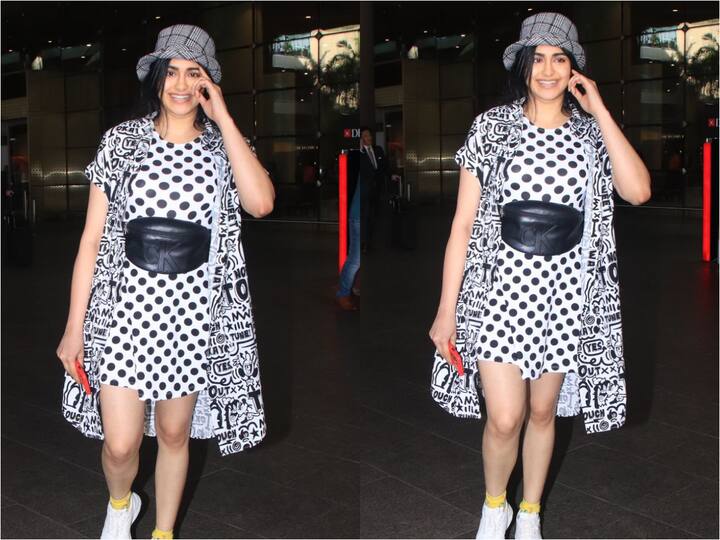 Adah was captured at the airport today in a black polka-dot dress. Check out her outfit.