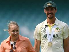 WTC Final: फाइनल मुकाबले में जीत के बाद पत्नी एलिसा हीली के साथ मैदान पर जश्न मनाते दिखे मिचेल स्टार्क, देखिए फोटो