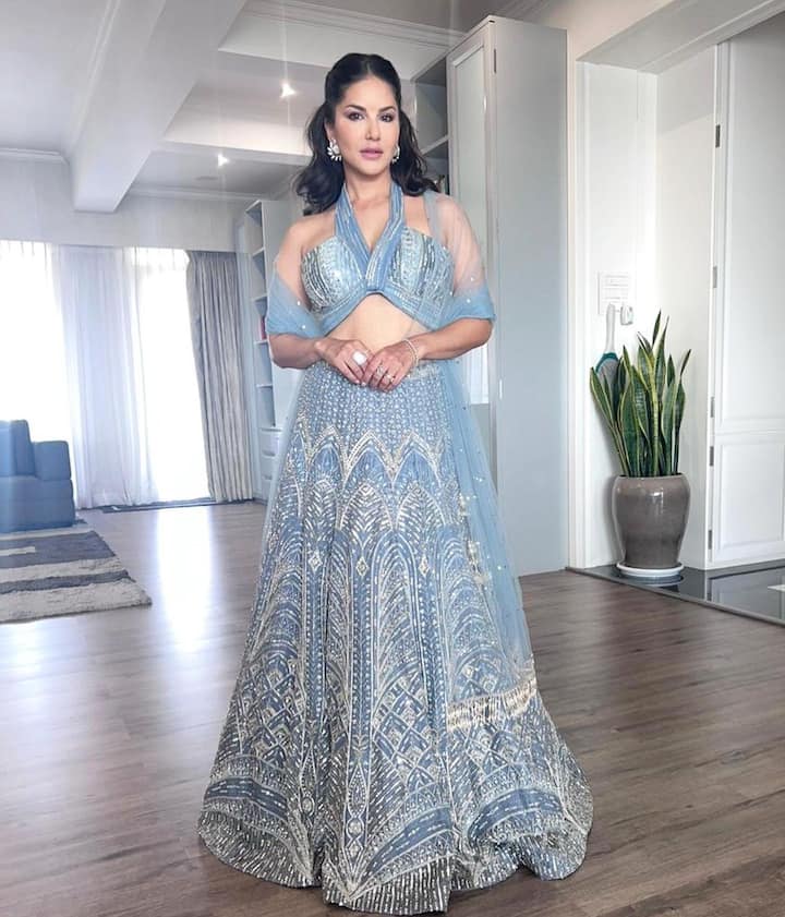 She complemented her husband Daniel, who was also dressed in a blue sherwani and silk kurta.