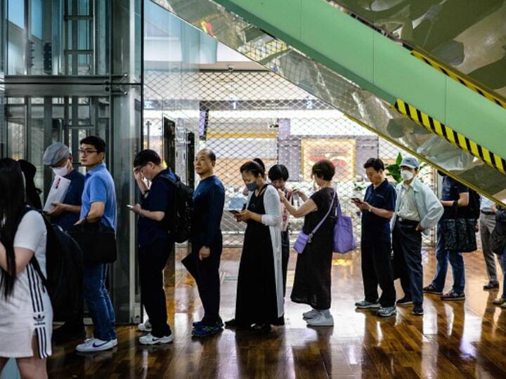 Fans queue to buy a special commemorative stamp series of BTS at a post office in Seoul. In 2021, the South Korean band was invited by US President Joe Biden to discuss the issue of Anti-Asian hate crimes in the US. Image Source: Getty Images