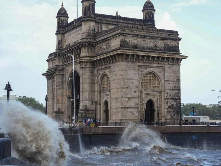 The Gateway of India in Mumbai looks majestic as waves hit the seafront. (Source: PTI)