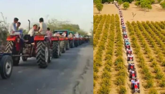 Rajasthan Wedding procession on-51 Tractors in barmer Stunned Social Media 51 ਟਰੈਕਟਰਾਂ ਨਾਲ ਨਿਕਲੀ ਅਨੋਖੀ ਬਾਰਾਤ, ਖੁਦ ਟਰੈਕਟਰ ਚਲਾ ਕੇ ਸਹੁਰੇ ਘਰ ਪਹੁੰਚਿਆ ਲਾੜਾ, ਦੇਖੋ ਵੀਡੀਓ 