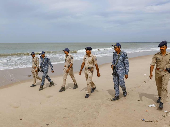 Gujarat and marine police personnel were seen patrolling the Mandvi beach ahead of the landfall of Cyclone Biparjoy earlier on Monday. The Gujarat government said 17 teams of the National Disaster Response Force (NDRF) and 12 of the State Disaster Response Force (SDRF) are on standby in the districts of Devbhumi Dwarka, Rajkot, Jamnagar, Junagadh, Porbandar, Gir Somnath, Morbi and Valsad. (Source: PTI)