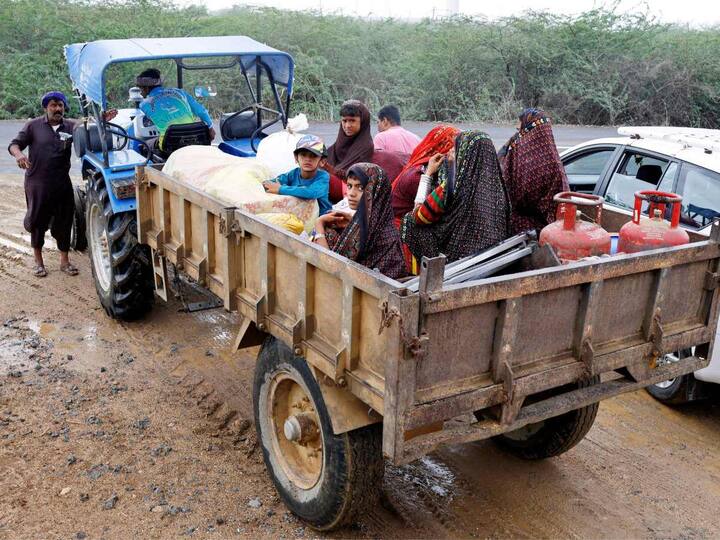 Villagers are using a tractor trolley to evacuate people in the coastal areas ahead of Cyclone Biparjoy making landfall on Thursday. (Source: PTI)