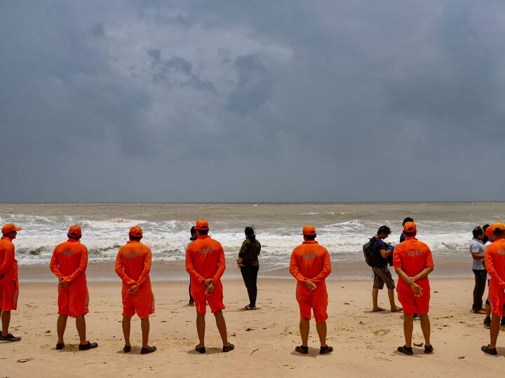 NDRF personnel at the Mandvi beach, in Kutch district on Wednesday. The wind speed is expected to range between 115 kmph to 125 kmph, reaching up to 140 kmph. (Image Source: PTI)
