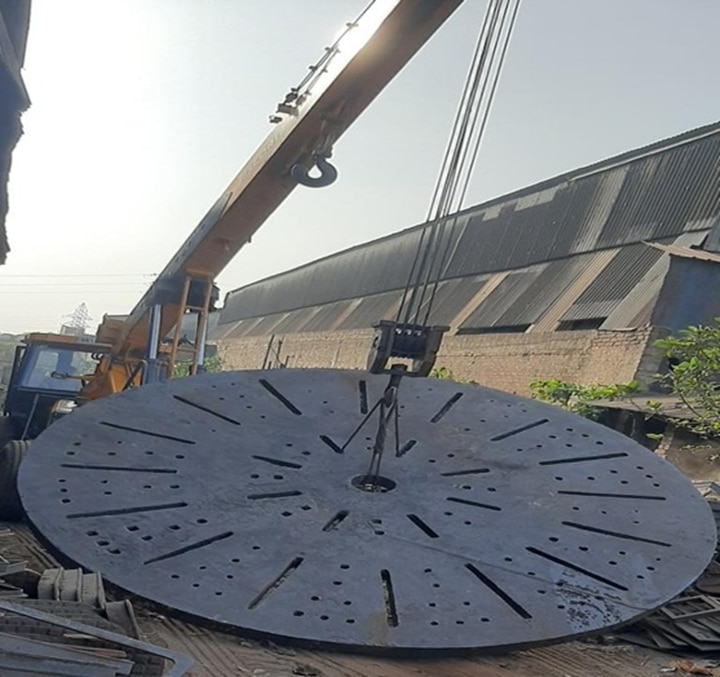 A manhole cover being loaded before being shipped