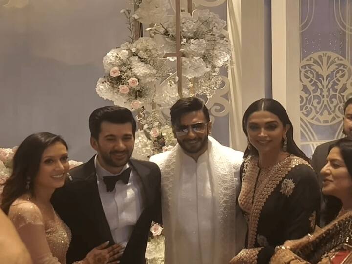 Deepika is spotted wearing a black Anarkali, while Ranveer is dressed in a short white sherwani, matching stole, and sunglasses.