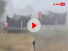 तेज आंधी में जंपिंग बेड पर चढ़ा शख्स और फिर उड़न तश्तरी की तरह हवा में उड़ गया... देखें वीडियो