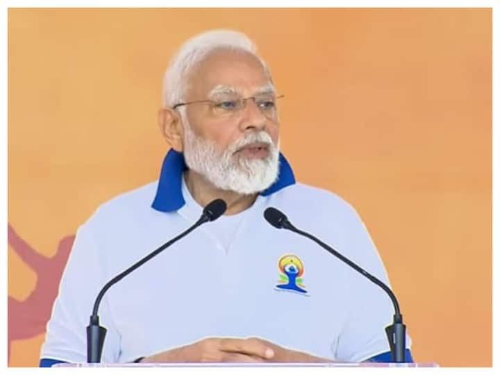 The prime minister, wearing a customised white yoga T-shirt and trousers, started his address with a 'Namaste' and thanked people for coming from far away to attend the celebration. 