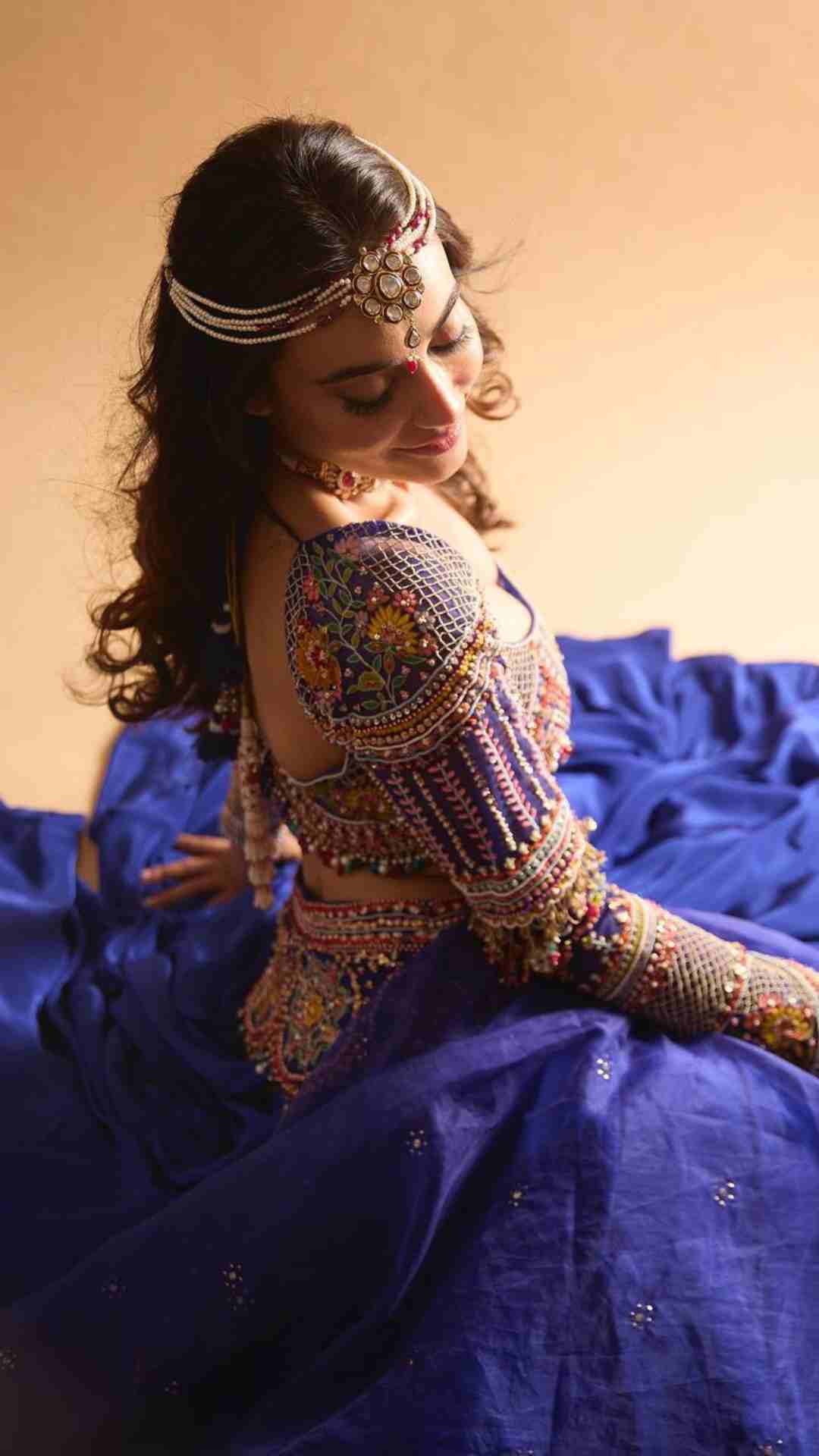 Photo of blue coloured smokey eye makeup matching the lehenga