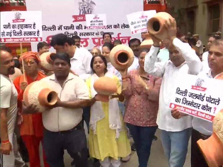 Several BJP workers were seen holdings posters asking who was responsible for the alleged Delhi Jal Board corruption. (Source: ANI)