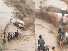 வெள்ளத்திற்கு மத்தியில் சிக்கி கொண்ட கார்... உள்ளே உயிருக்கு போராடும் பெண்... துணிச்சலாக செயல்பட்ட உள்ளூர்வாசிகள்..!
