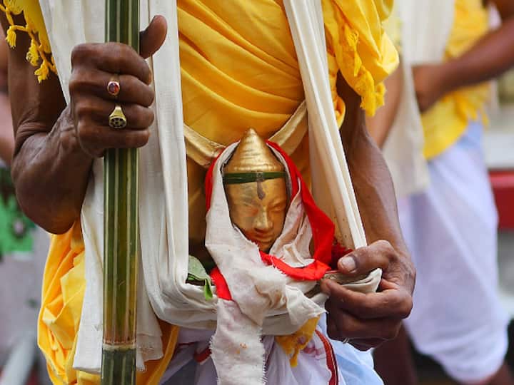 Priests in traditional attire perform ancient rituals with devotion, seeking blessings for prosperity and well-being. (Image Source: Getty)