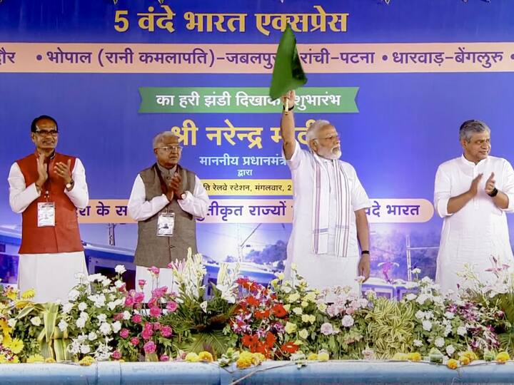 Prime Minister Narendra Modi on Tuesday flagged off five Vande Bharat trains even as his trip to Madhya Pradesh was curtailed due to a warning of heavy rainfall. Union Railways Minister Ashwini Vaishnaw, Madhya Pradesh Governor Mangubhai Patel and Chief Minister Shivraj Singh Chouhan were also present. (Image Source: PTI)