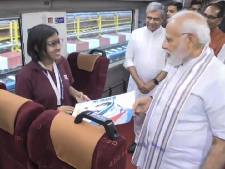 PM Modi interacted with school students aboard the Vande Bharat Express train as he flagged off the superfast trains at Rani Kamalapati Railway Station in Madhya Pradesh's Bhopal. In a video shared by the news agency ANI, PM Modi could be seen surrounded by school students as some of them presented their thoughts in front of him. (Image Source: PTI)