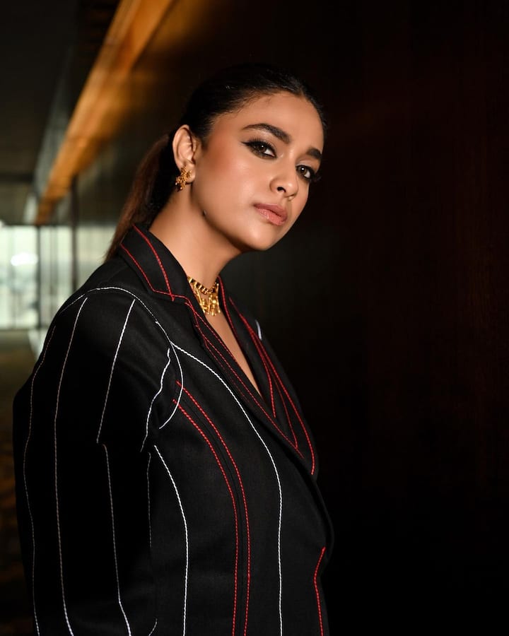 Keerthy tied her hair in a high ponytail and accessorised with earrings and a neck piece