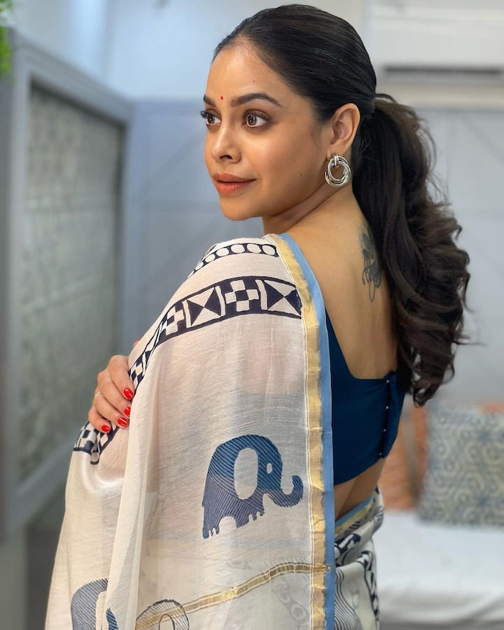 Sumona also shared pictures in a white-blue saree