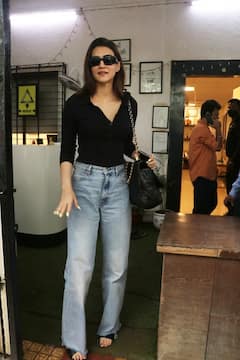 Kriti Sanon Aces Casual Look In A Black Top And Blue Jeans - See Pics