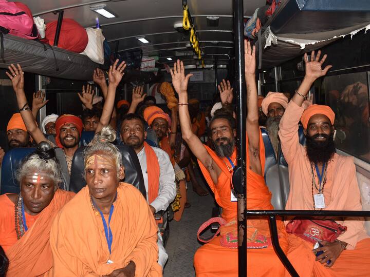 Sadhus shout religious slogans after boarding a bus as the first batch of pilgrims leaves for the Amarnath Yatra 2023. (Source: PTI)