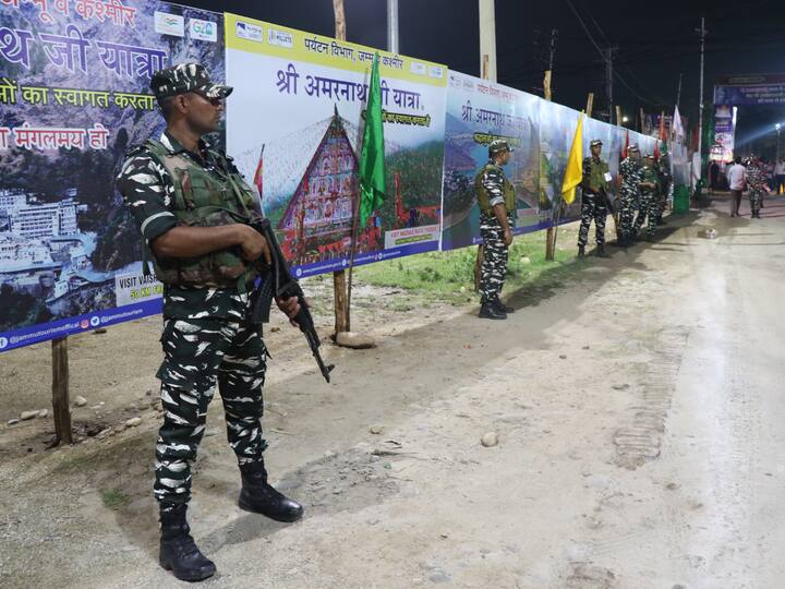 Security personnel keep vigil as a convoy of the first batch of Amarnath Yatra 2023 pilgrims leaves for Kashmir, in Jammu. (Source: PTI)