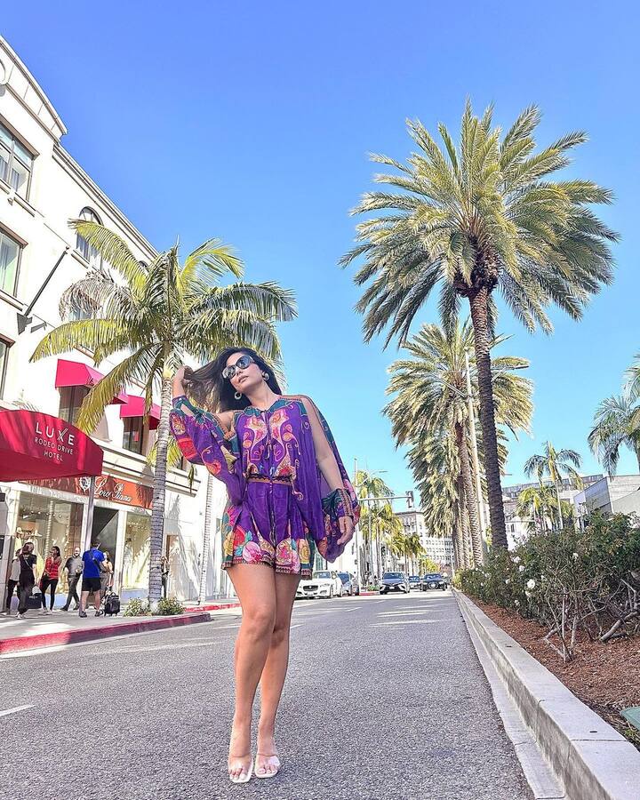 She paired her outfit with white sandals and black shades. (Image Source: Instagram/ Hina Khan)