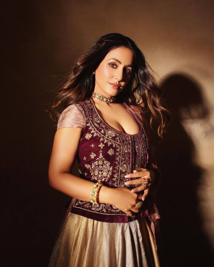 Hina looked stylish in a beige and maroon royal anarkali set