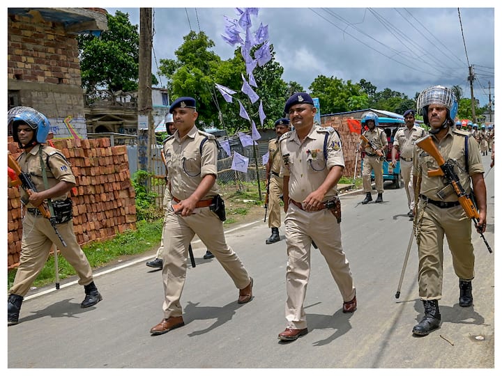 Security personnel conduct a route march ahead of the West Bengal panchayat elections, in Nadia, Thursday. (Image: PTI)
