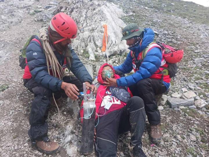 The Amarnath Yatra was halted temporarily by officials due to bad weather along the Baltal and the Pahalgam routes on Friday. Meanwhile, Jammu and Kashmir Police’s Mountaineering Rescue Team (MRT) personnel were seen giving supplemental oxygen to an Amarnath Yatra pilgrim during his trek in Anantnag district. (Source: PTI)