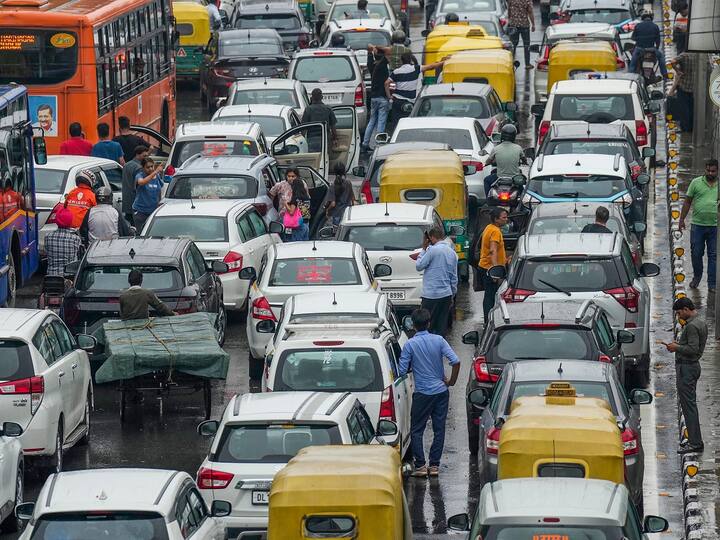 The first spell of heavy monsoon rain caused mayhem in Delhi's residential and commercial areas on Saturday, with inundated roads and overflowing drains causing massive waterlogging and paralysing traffic for hours. (Image Source: PTI)